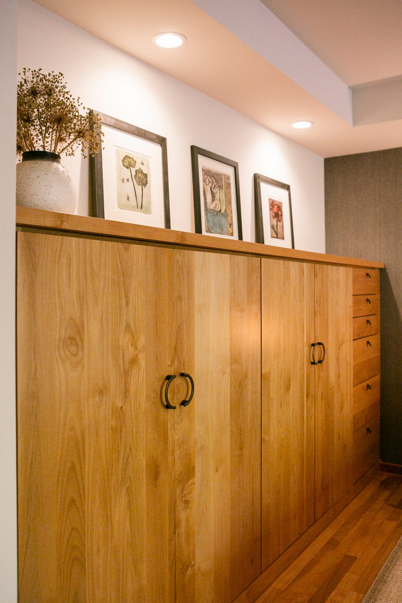 Custom bedroom cabinetry with matchbook design.